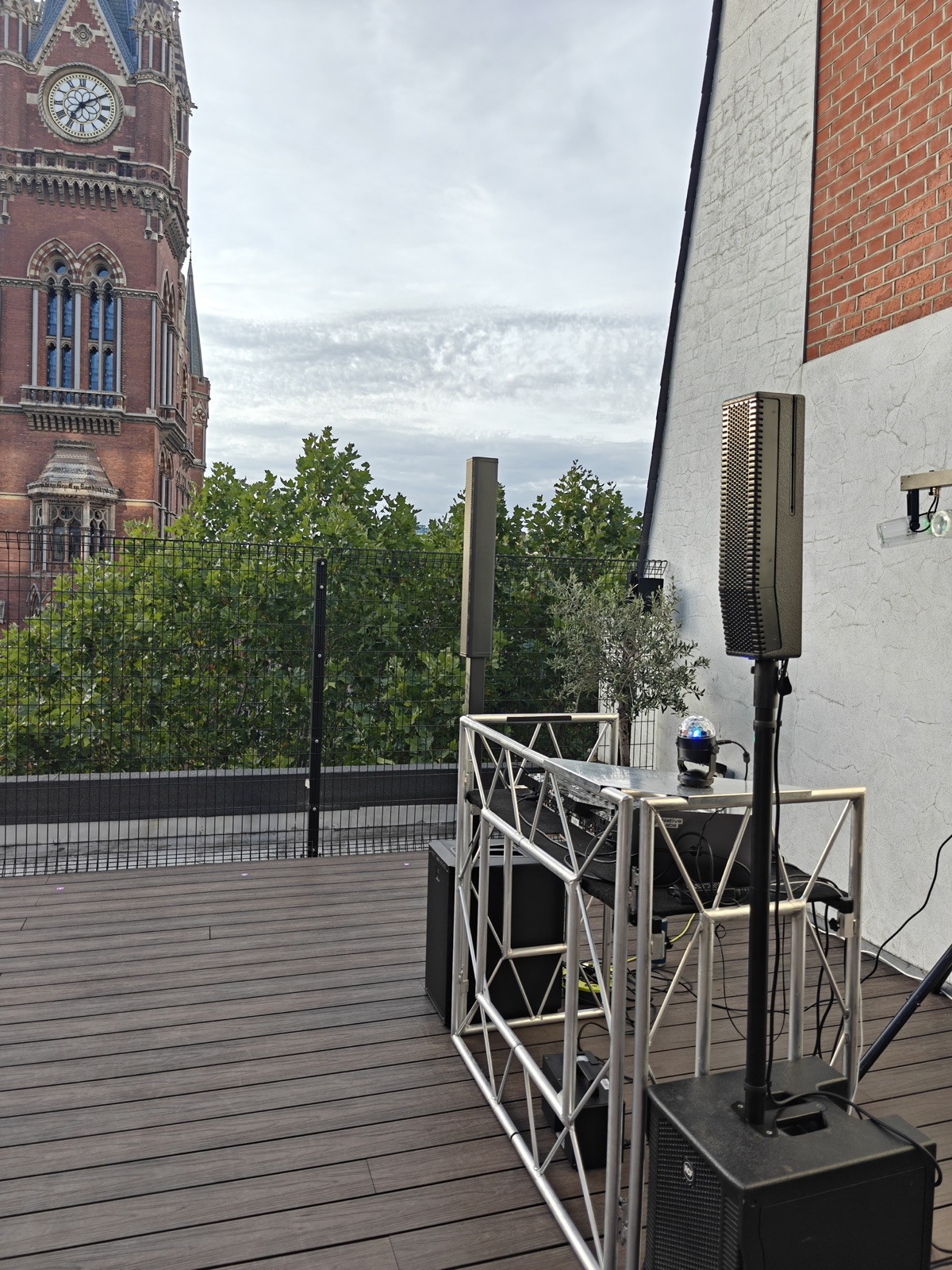 DJ Brooks set up on a London rooftop terrace with St Pancras in view
